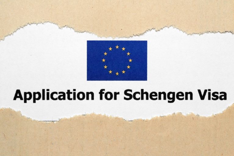 Schengen Visa a piece of paper with a flag and stars